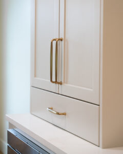 light upper cabinets with brass hardware
